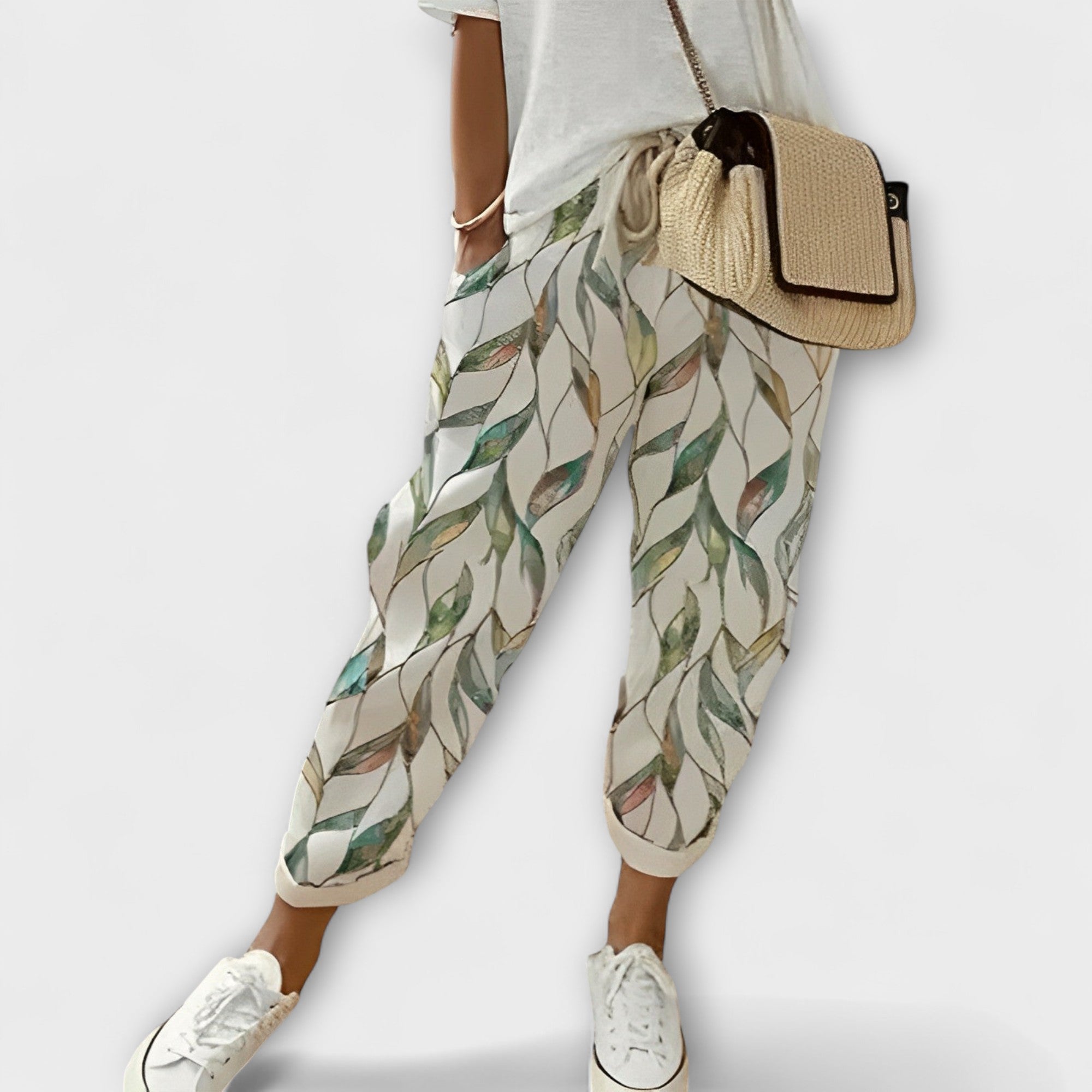 Boho tapered pants with light green leaf print, drawstring waist, elastic cuffs