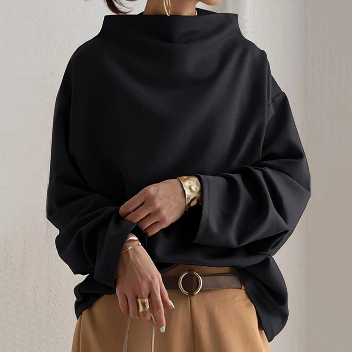Black high-neck pullover sweater with long sleeves and relaxed fit
