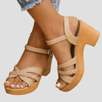 Beige platform sandals with ankle strap, braided toe detail, and chunky block heel