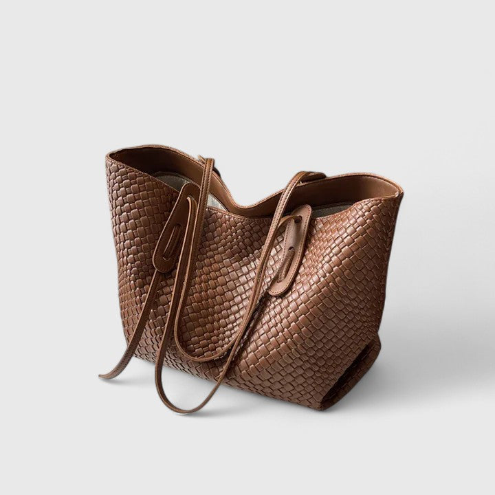 Medium brown woven tote bag with two top handles and zip closure