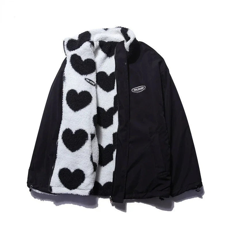 Black reversible winter jacket with smooth outer shell and heart-fleece trim