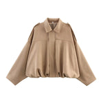 Beige short jacket with pointed collar, center zip, gathered hem and long sleeves
