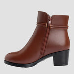Brown ankle boots with side zipper, stitched strap detail, and block heel