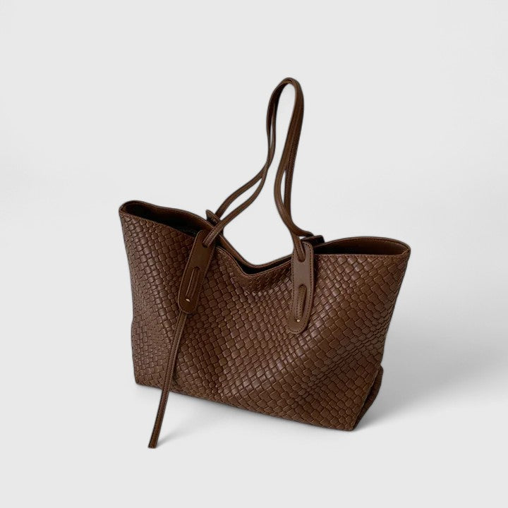 Dark brown woven tote bag with top handles and zip closure