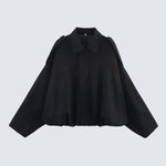 Black short jacket with pointed collar, center zip, gathered hem and long sleeves