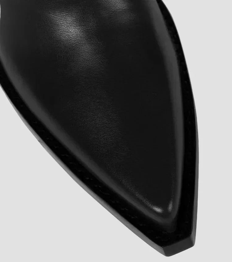 Black leather-look knee-high boot upper with smooth texture and angled toe