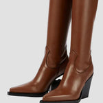 Brown knee-high heeled boots with seam detail and pointed toe on block heel