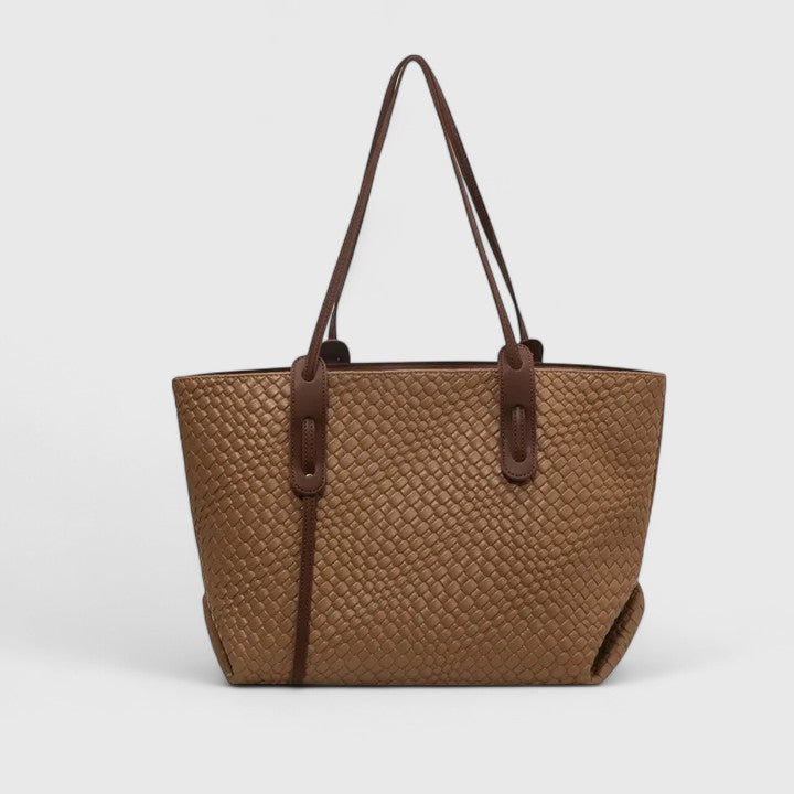 Tan woven tote bag with two top handles and zip closure