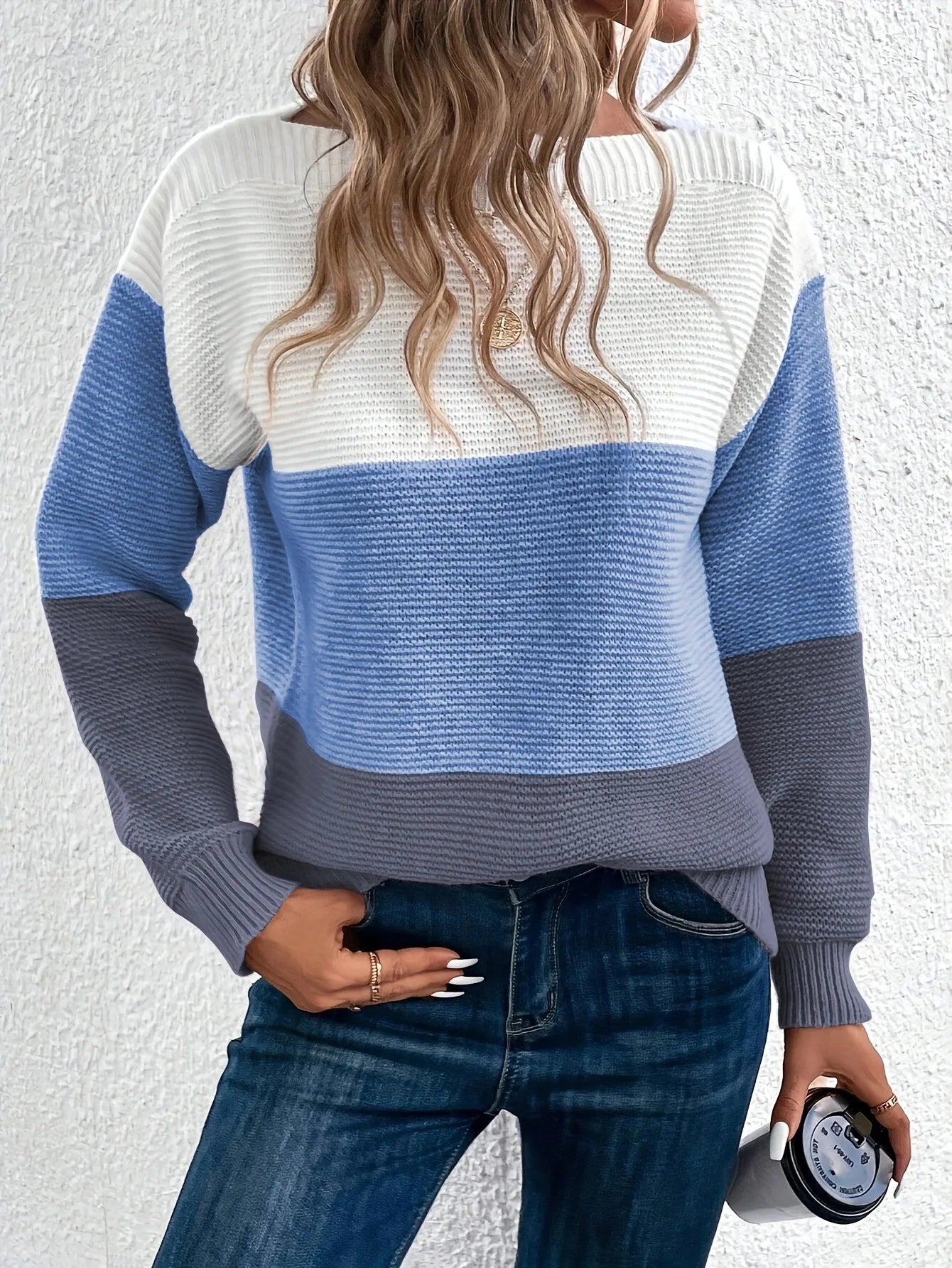 Color-block knit sweater, crew neck, long sleeves; white, light blue, and dark gray panels.