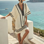 Cream beach tunic dress with black trim, embroidered panel, short sleeves, loose fit