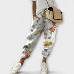 Boho tapered pants with white floral print, drawstring waist, elastic ankle cuffs