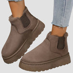 Brown suede ankle boots with elastic side goring and cushioned thick sole