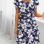 Navy floral short-sleeve dress with scoop neckline and layered hem