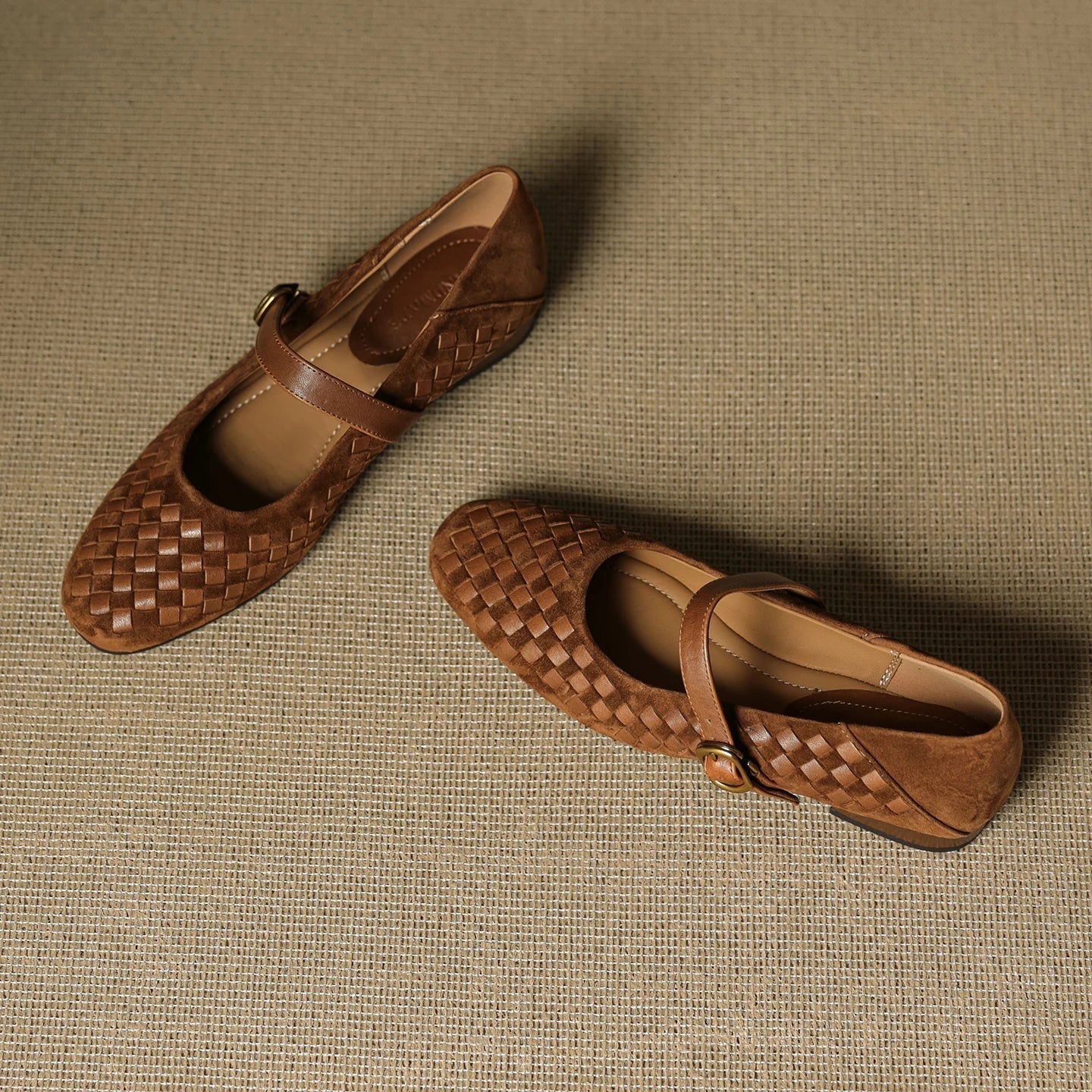 Brown woven leather sandals with ankle strap and gold-tone buckle