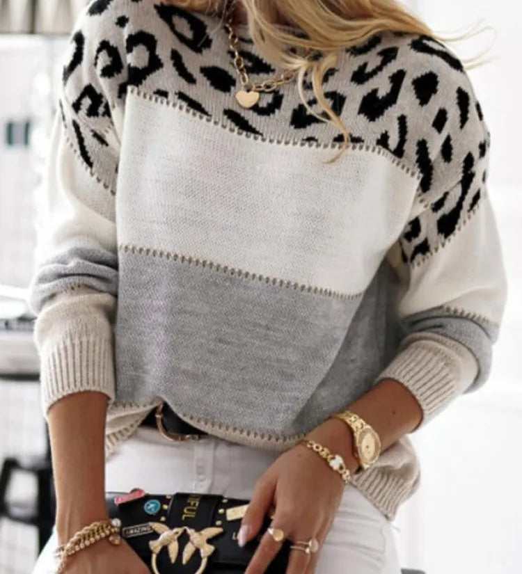 Leopard print knit pullover sweater, gray body with black spots across upper yoke
