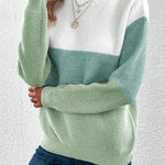 Color-block knit sweater, crew neck, long sleeves; white and mint green panels.