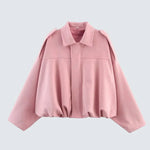 Pink short jacket with pointed collar, zip front, gathered hem and long sleeves