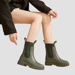 Waterproof olive green Chelsea boots with elastic side panels and chunky tread sole
