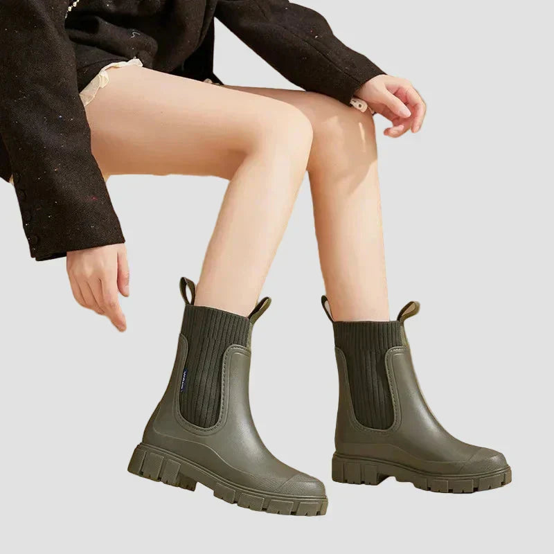 Waterproof olive green Chelsea boots with elastic side panels and chunky tread sole