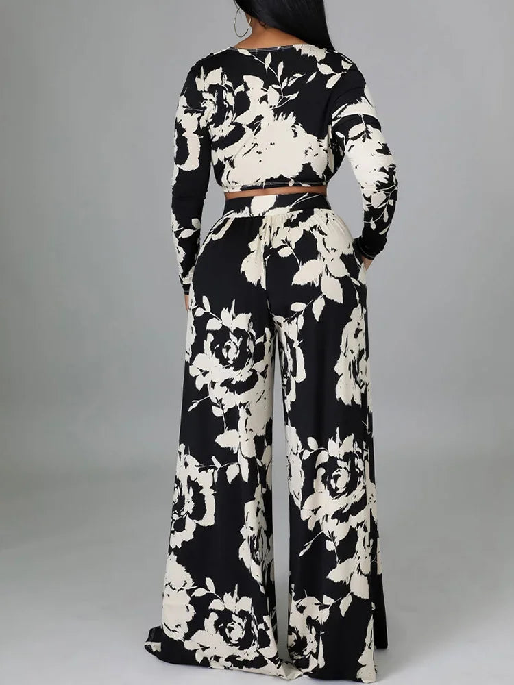 Black & white floral two-piece set with long-sleeve cropped top and wide-leg pants