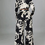 Black & white floral two-piece set with long-sleeve cropped top and wide-leg pants