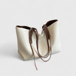 Cream woven tote bag with two top handles and zip closure