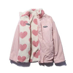Light pink reversible winter jacket showing heart-fleece lining with stand collar