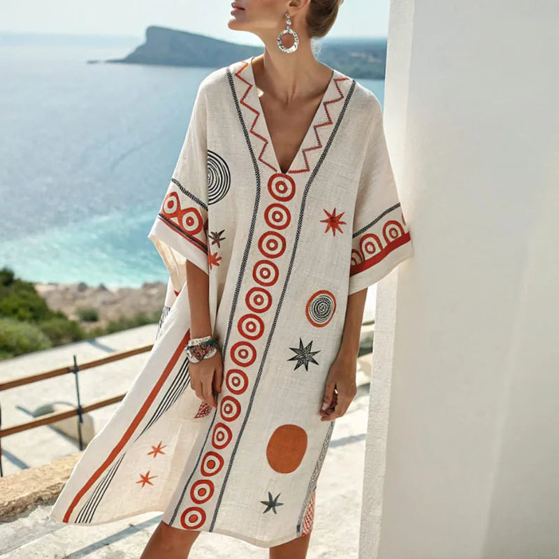 White beach tunic with orange geometric print, V neckline, short sleeves
