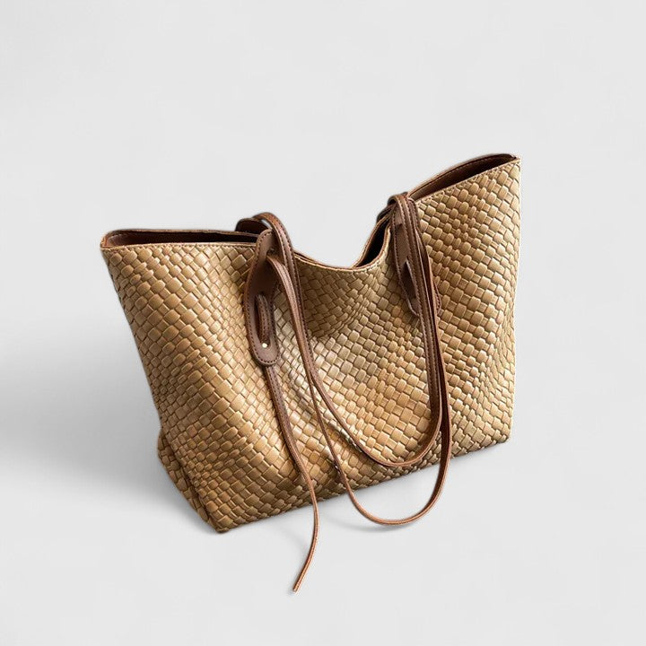 Light gold woven tote bag with two top handles and zip closure
