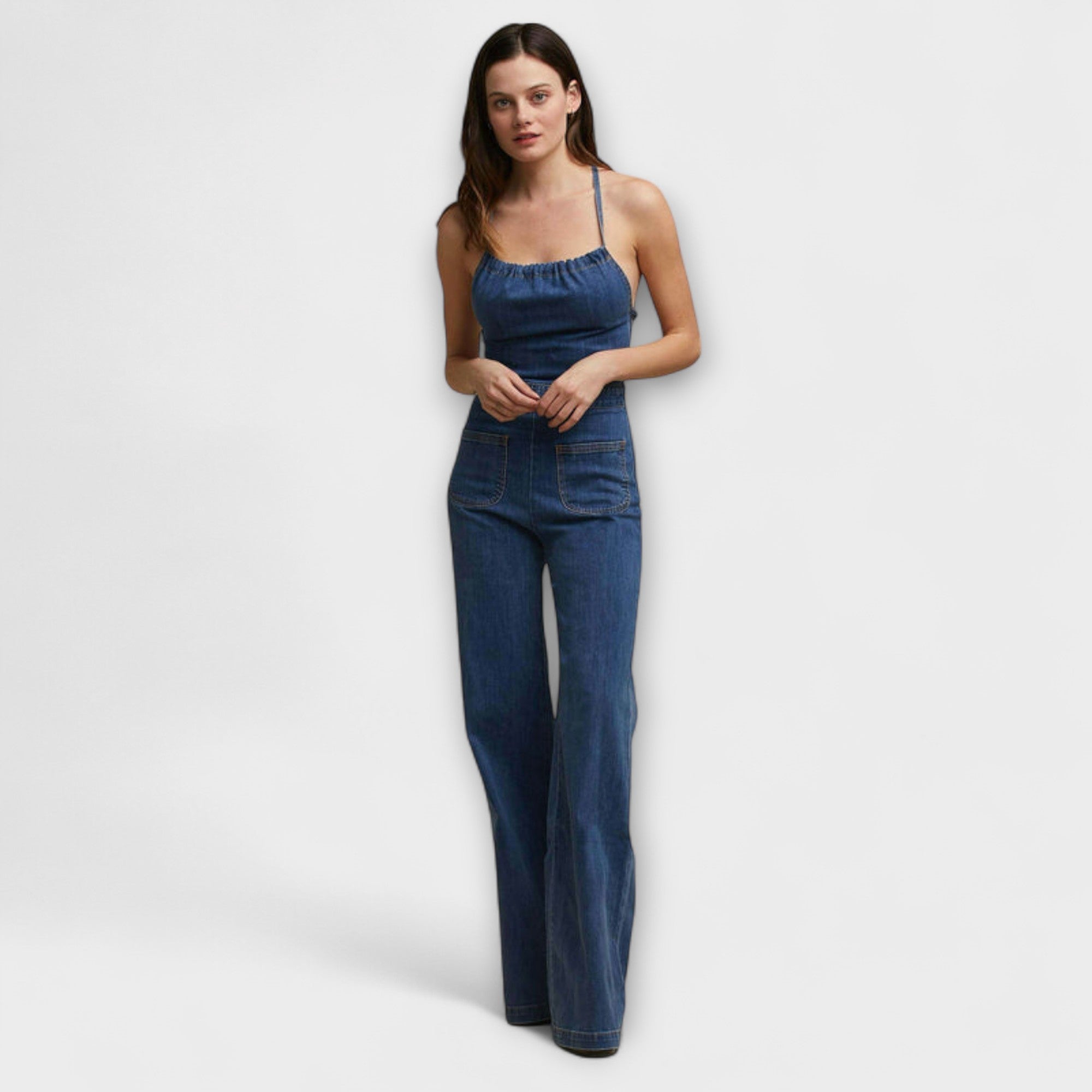 Blue denim sleeveless flare-leg overalls with front bib and straight straps