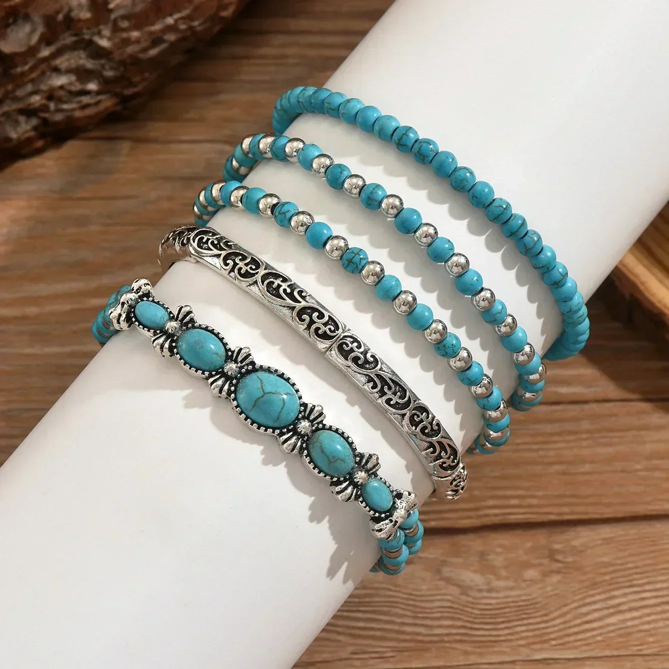 Turquoise beaded bracelet set with silver filigree bars and oval turquoise charms