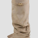 Light beige tall boots with buckle strap and slouchy folded shaft