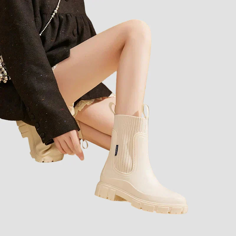 Waterproof beige Chelsea boots with elastic side panels and chunky tread sole