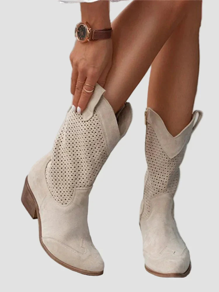 Light beige cowboy ankle boots with perforated panels and side zipper