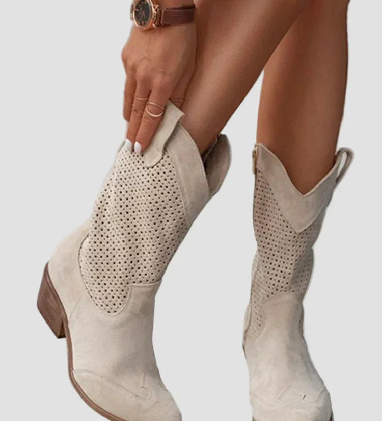 Light beige cowboy ankle boots with perforated panels and side zipper