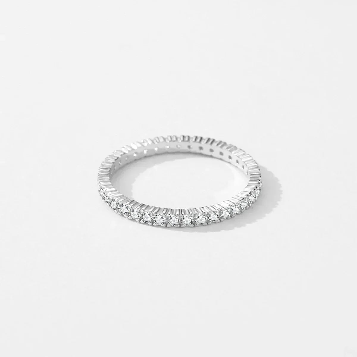 Silver eternity ring with pavé stones around the band