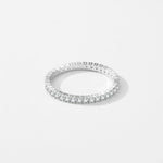 Silver eternity ring with pavé stones around the band