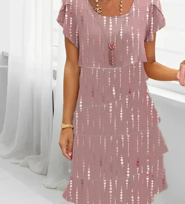 Victoria pink shift dress with dotted gold pattern, flutter sleeves, layered skirt hem