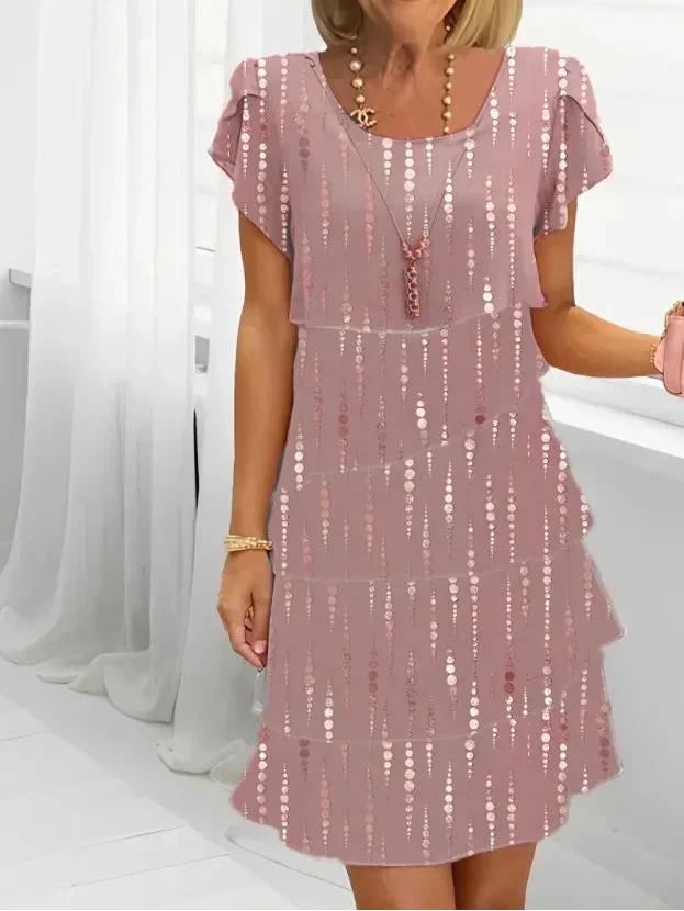 Victoria pink shift dress with dotted gold pattern, flutter sleeves, layered skirt hem