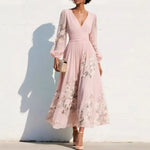 Blush pink floral midi dress with V-neck, long sheer sleeves, and gathered waist