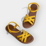 Handmade yellow flat sandals with crisscross toe straps and ankle strap