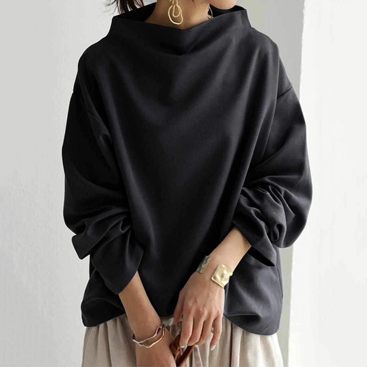 Black high-neck pullover sweater with draped long sleeves