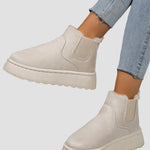 Beige winter ankle boots with elastic side panels and thick rubber sole
