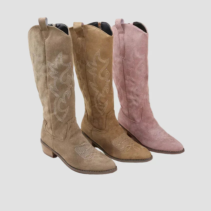 Pair of suede cowboy western boots in tan and pink, pull-on with stitched star motifs
