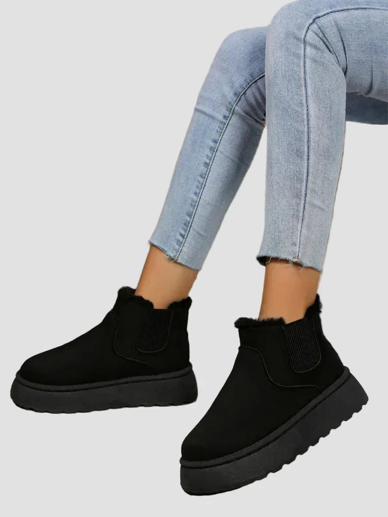 Black suede ankle boots with elastic side goring and thick cushioned sole