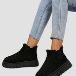 Black suede ankle boots with elastic side goring and thick cushioned sole