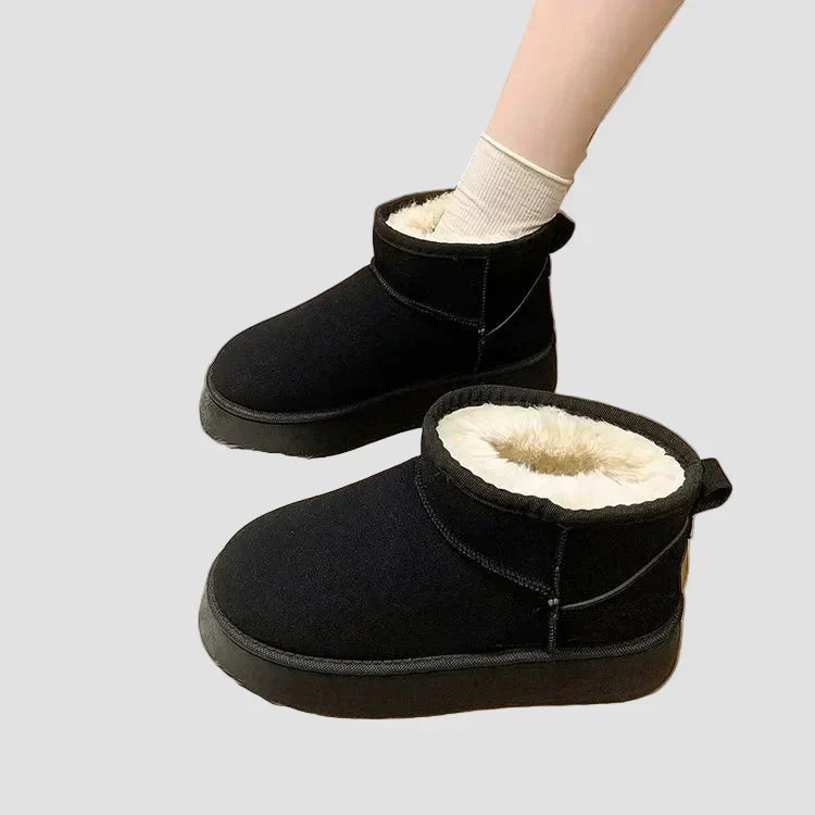 Black suede comfort ankle boots with thick plush lining and slip-on design