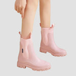 Waterproof pink Chelsea boots with elastic side panels and chunky tread sole