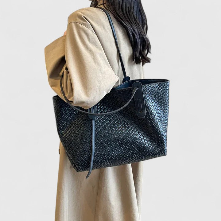 Dark blue woven tote bag with two top handles and zip closure