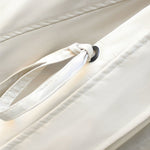 Modern jacket, off-white with drawstring hood and black button grommet